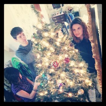 Helping grandma trim her Christmas tree 2013